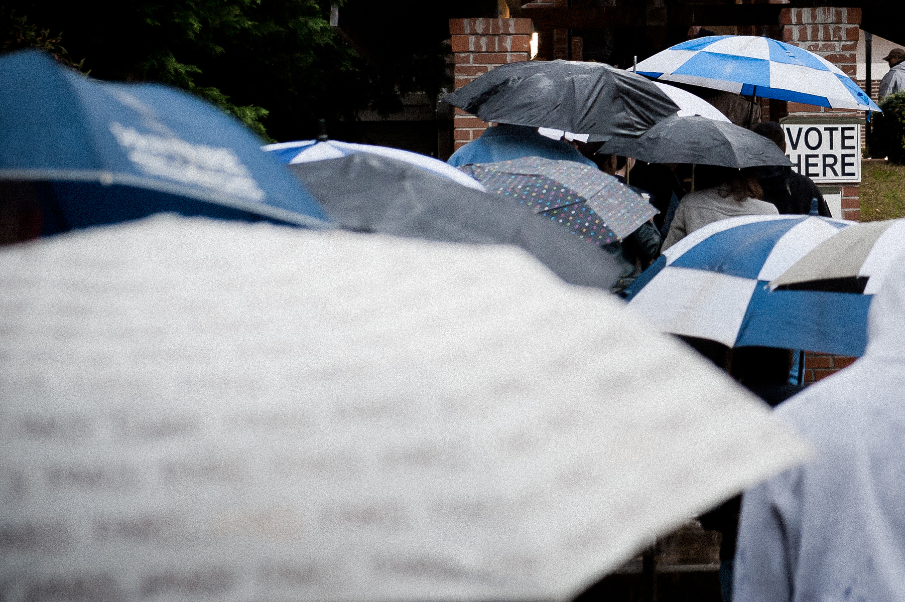 November 6, 2012.   Cobb County, GA. Voters wait in the rain lto cast their ballot in the 2012 Presidential election.  The swing state of Georiga is a hotly-contested  that offers 16 electoral votes.