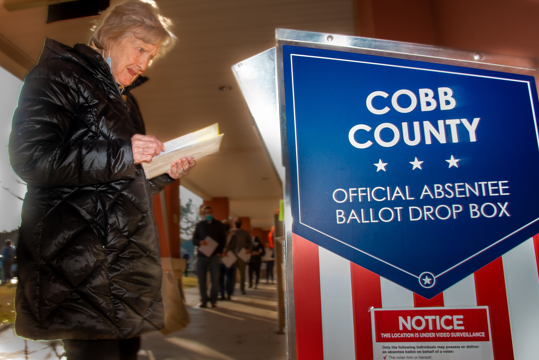 December 17, 2020 – Marietta, GA. A voter drops off a ballot during the U.S Senate run-off race.