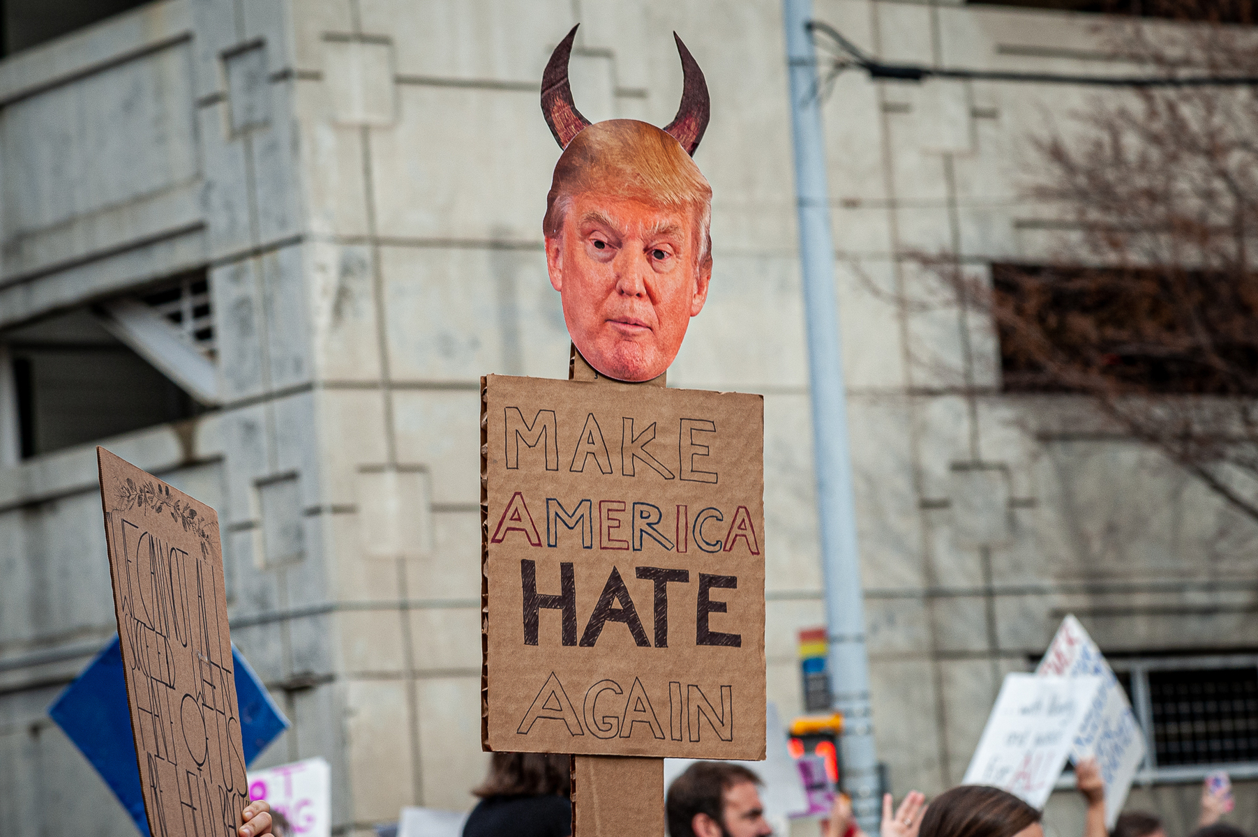 January 21, 2017 - Atlanta, Georgia. An attendee at the  Atlanta March for Social Justice and Women holds up a sign in protest of President-Elect Donald J. Trump. An estimated 60,000 demonstrators  attended the march.